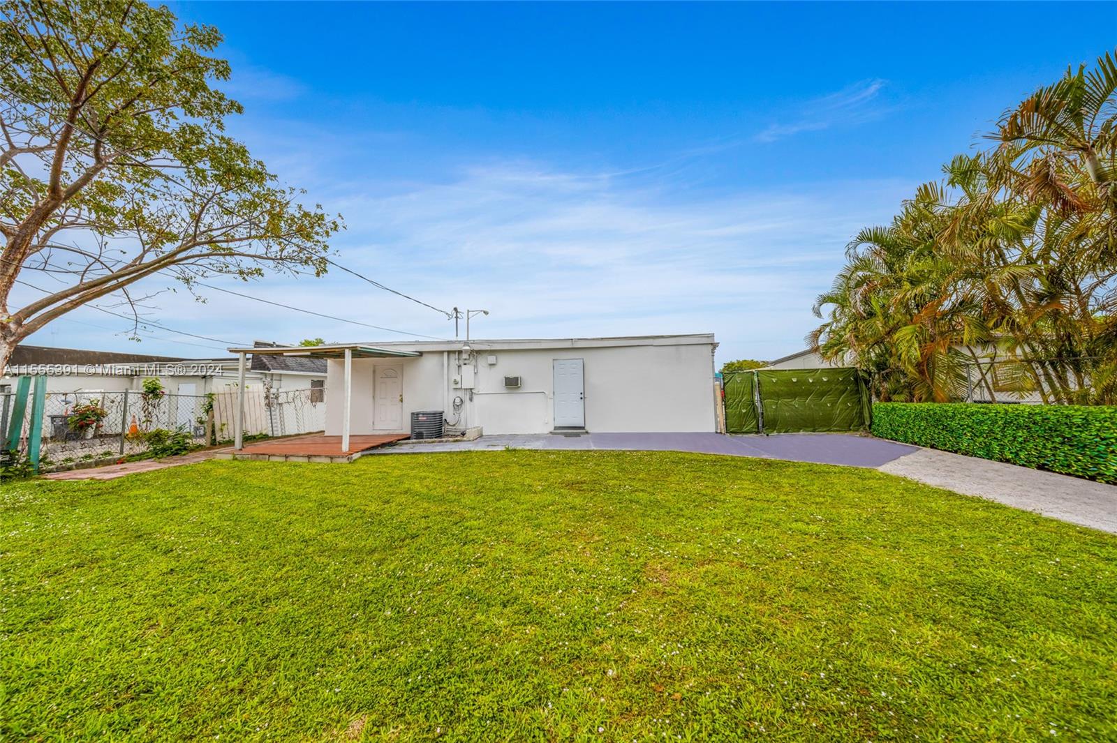 6335 Pembroke Road Hollywood, FL 33023 - Photo 22 of 29 a view of swimming pool with lawn chairs and plants