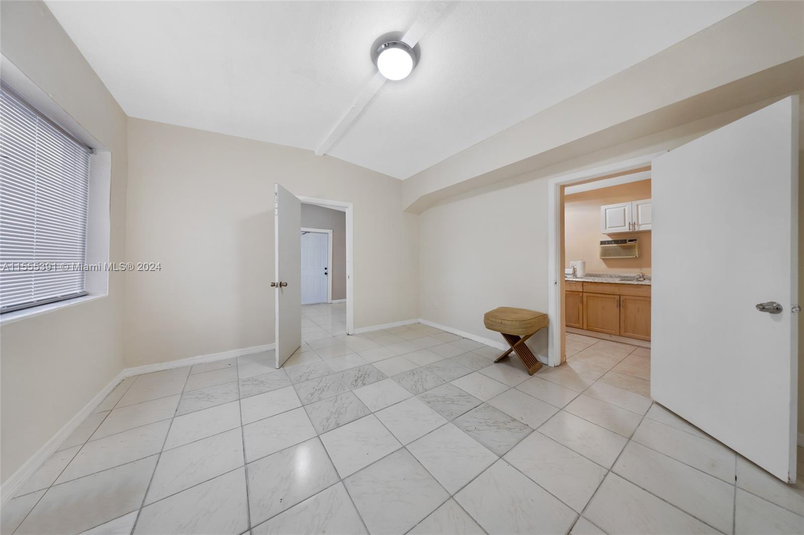 6335 Pembroke Road Hollywood, FL 33023 - Photo 23 of 29 a view of an empty room with a window