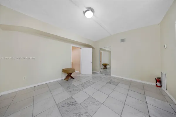 a kitchen with granite countertop cabinets stainless steel appliances and a sink