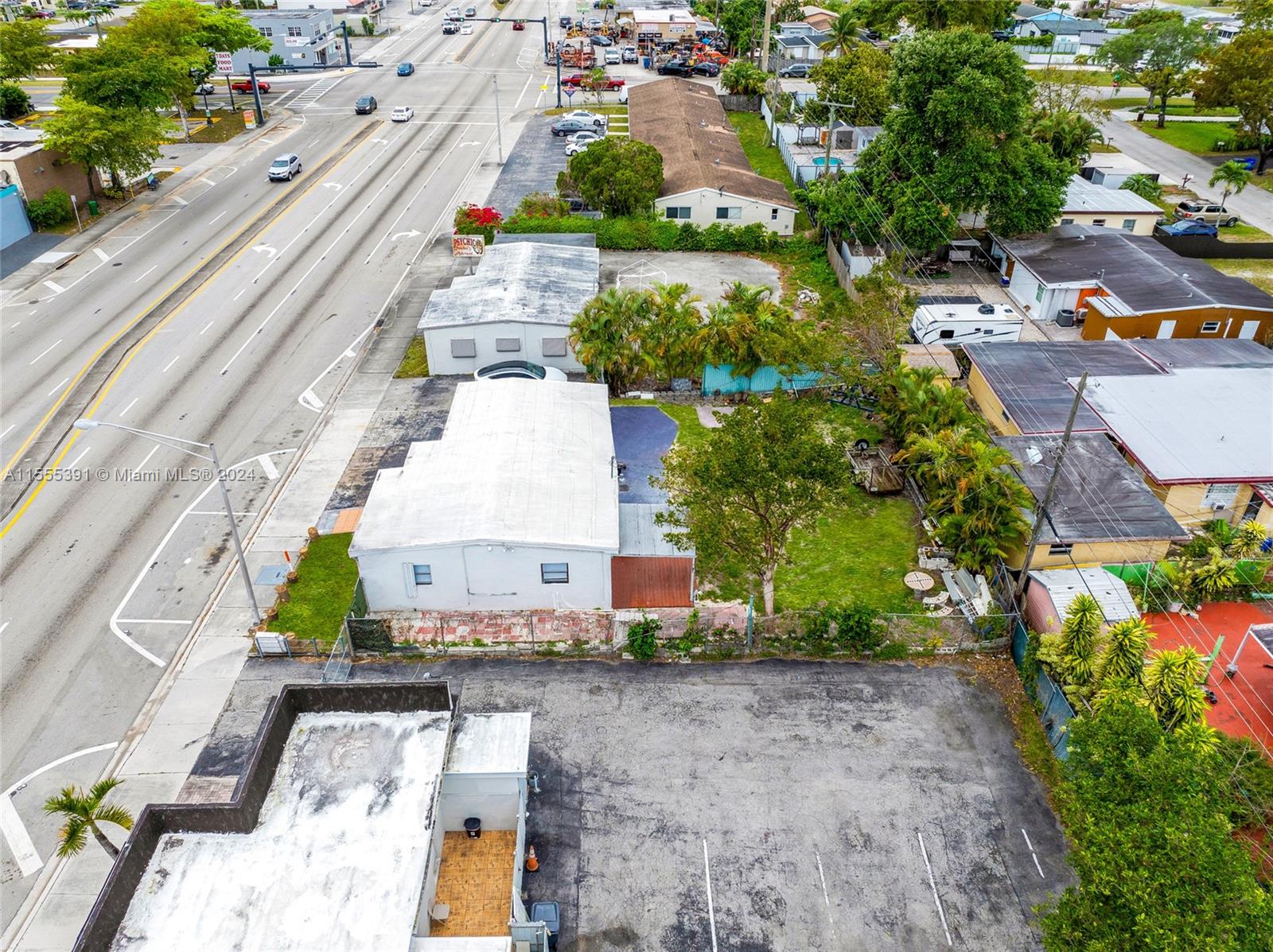6335 Pembroke Road Hollywood, FL 33023 - Photo 6 of 29 an aerial view of a house with a yard and lake view