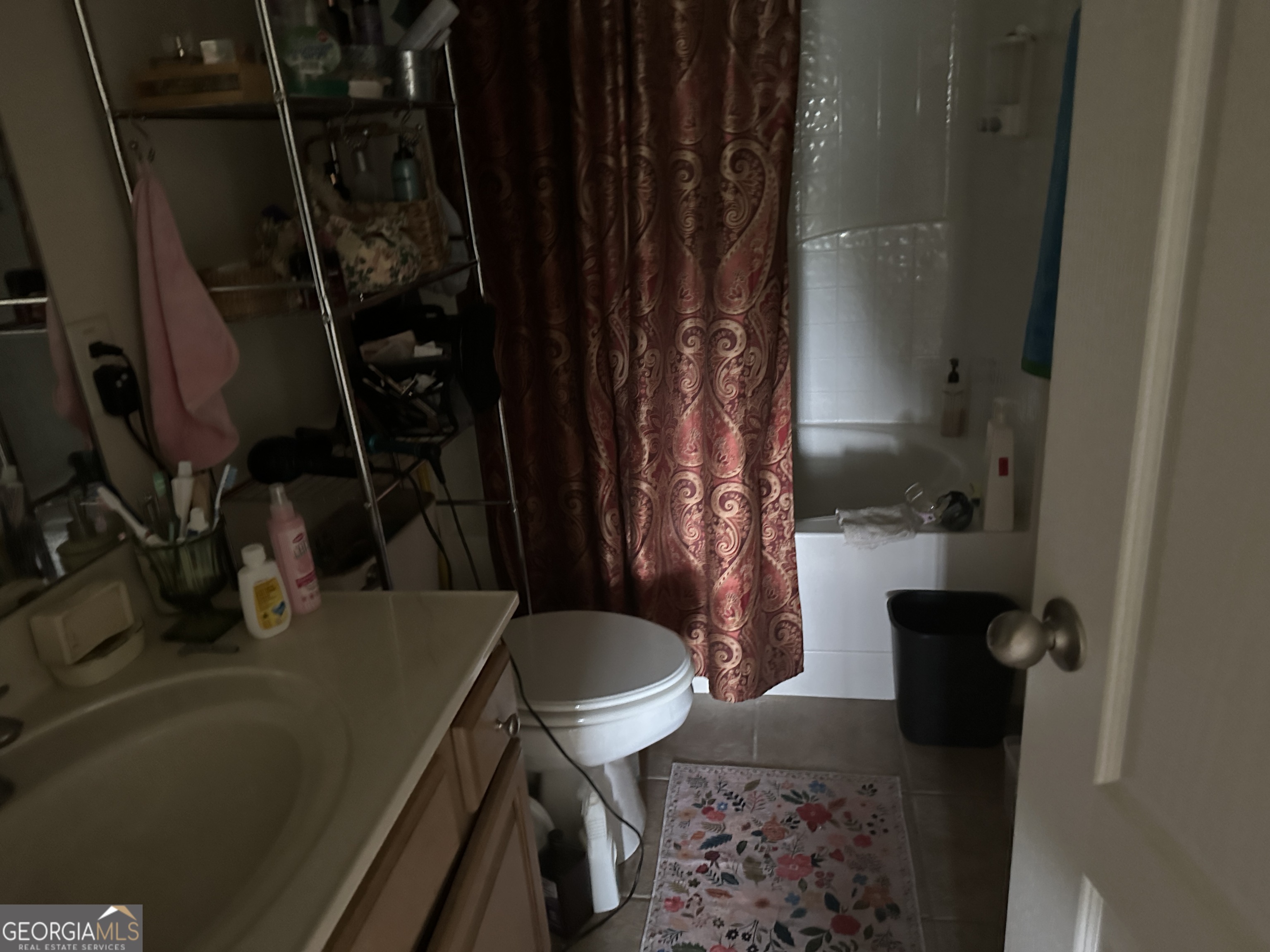 407 High Falls Road Jackson, GA 30233 - Photo 12 of 20 a bathroom with a sink toilet and shower
