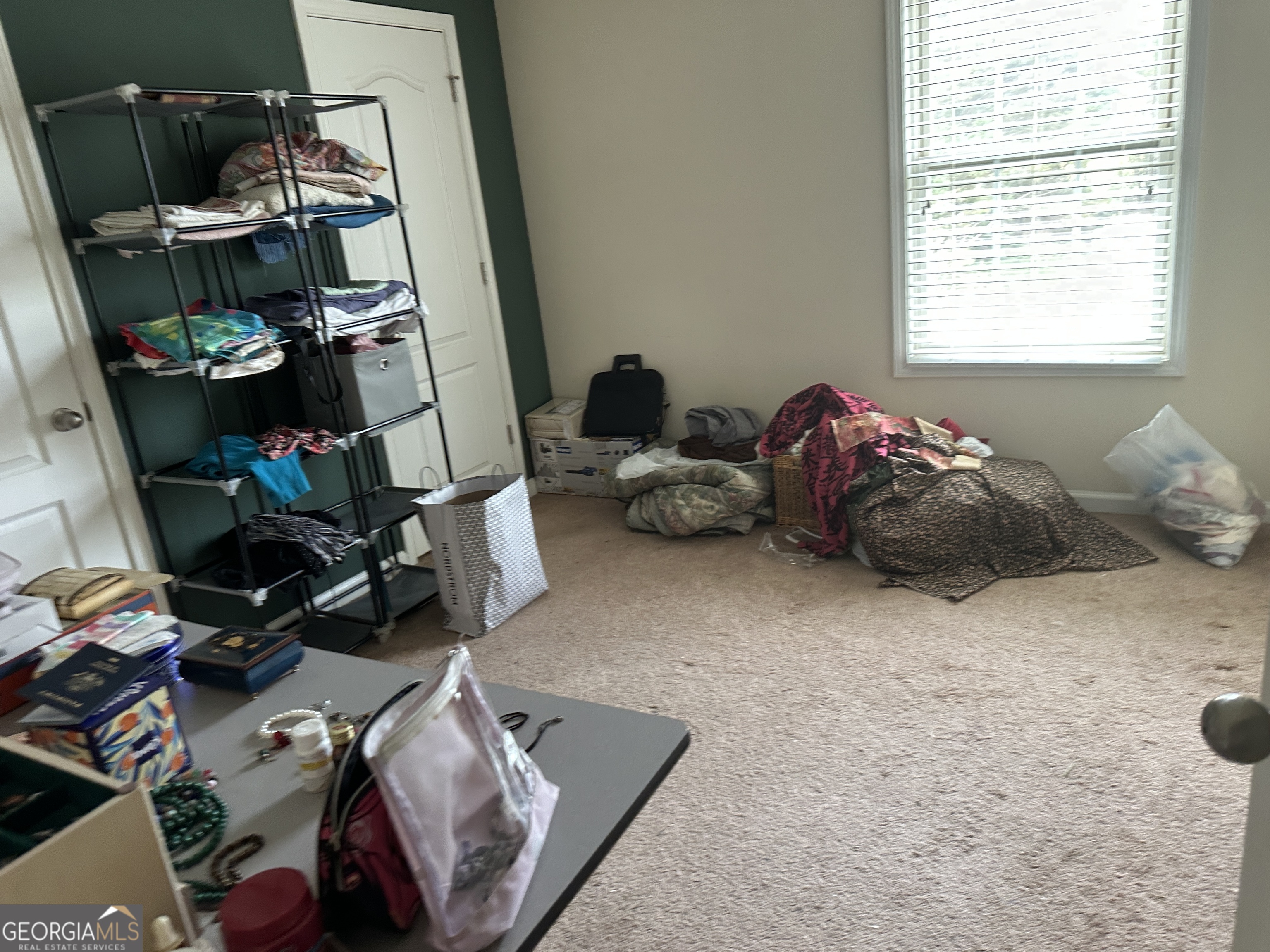 407 High Falls Road Jackson, GA 30233 - Photo 16 of 20 a room with a baby crib and a wooden floor