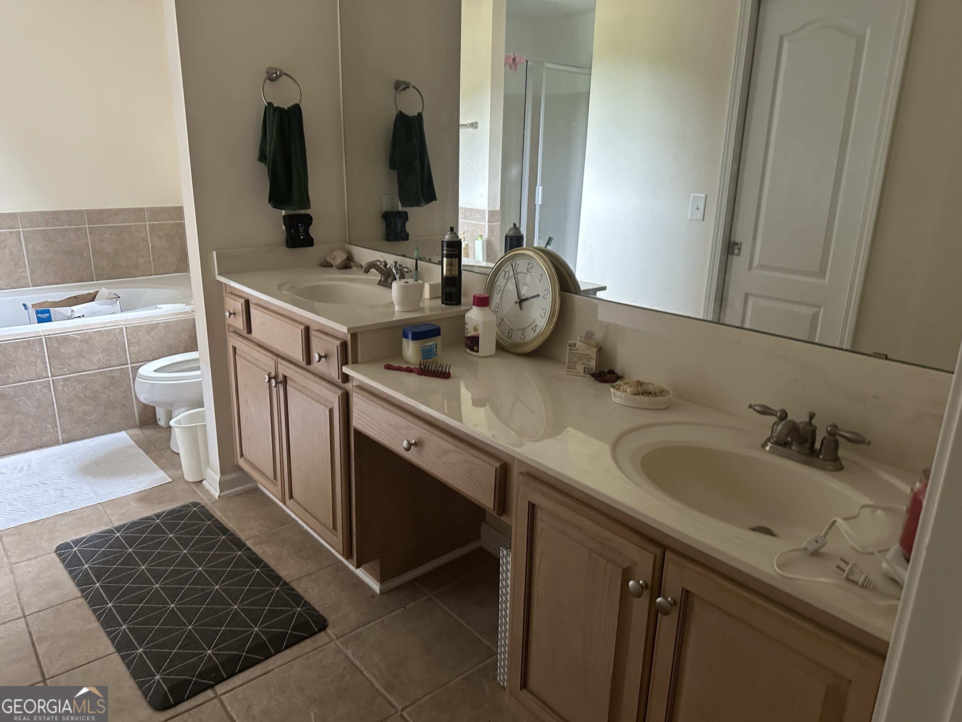 407 High Falls Road Jackson, GA 30233 - Photo 18 of 20 a bathroom with double vanity and a mirror