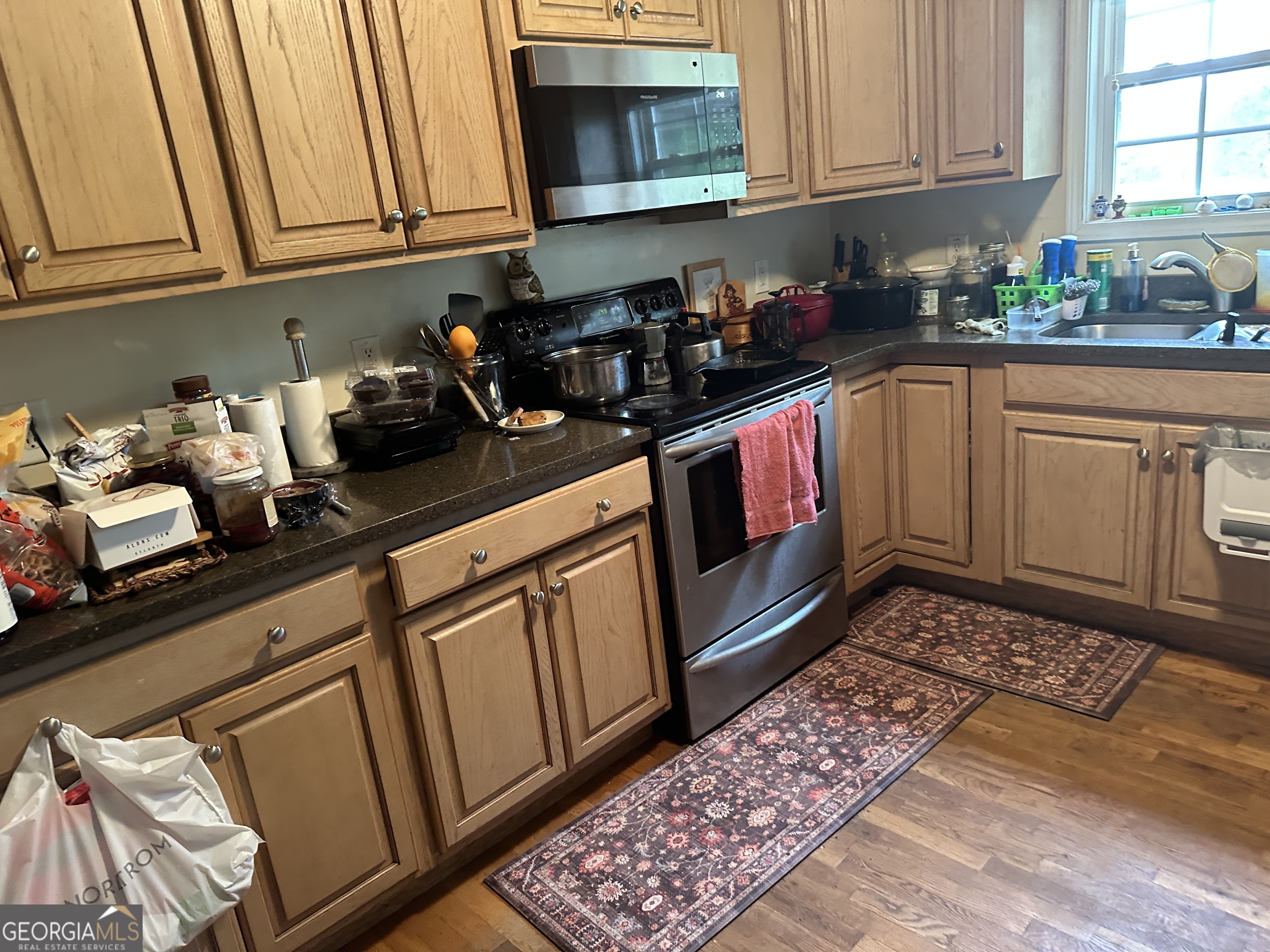 407 High Falls Road Jackson, GA 30233 - Photo 5 of 20 a kitchen with stainless steel appliances granite countertop a sink dishwasher stove and cabinets