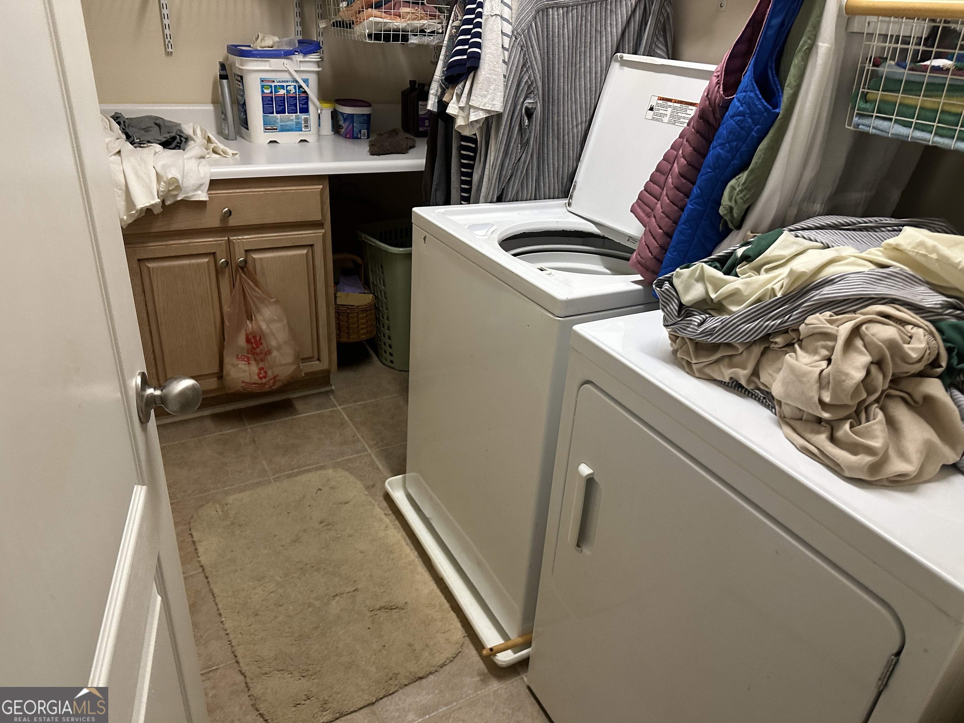407 High Falls Road Jackson, GA 30233 - Photo 6 of 20 a view of workspace with washer and dryer