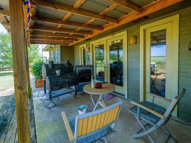 a view of a yard with wooden fence