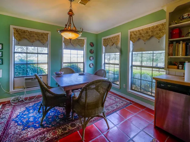 a living room with a gaming and a table