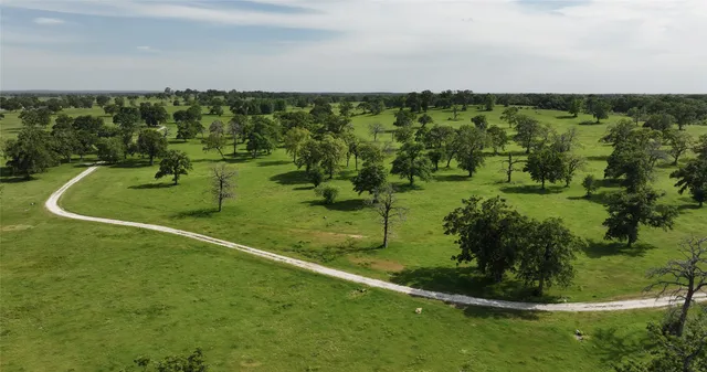a view of a lake with a yard
