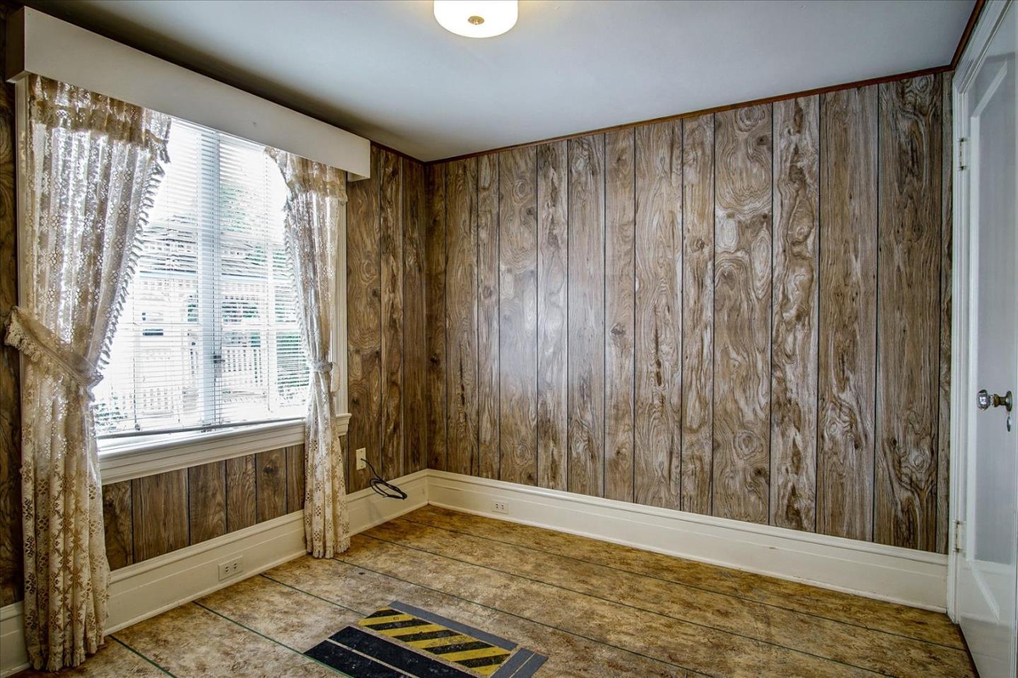 286 5th Street Gilroy, CA 95020 - Photo 18 of 47 a view of an empty room with a window