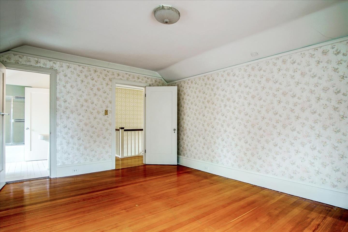 286 5th Street Gilroy, CA 95020 - Photo 25 of 47 a view of an empty room with wooden floor and a window
