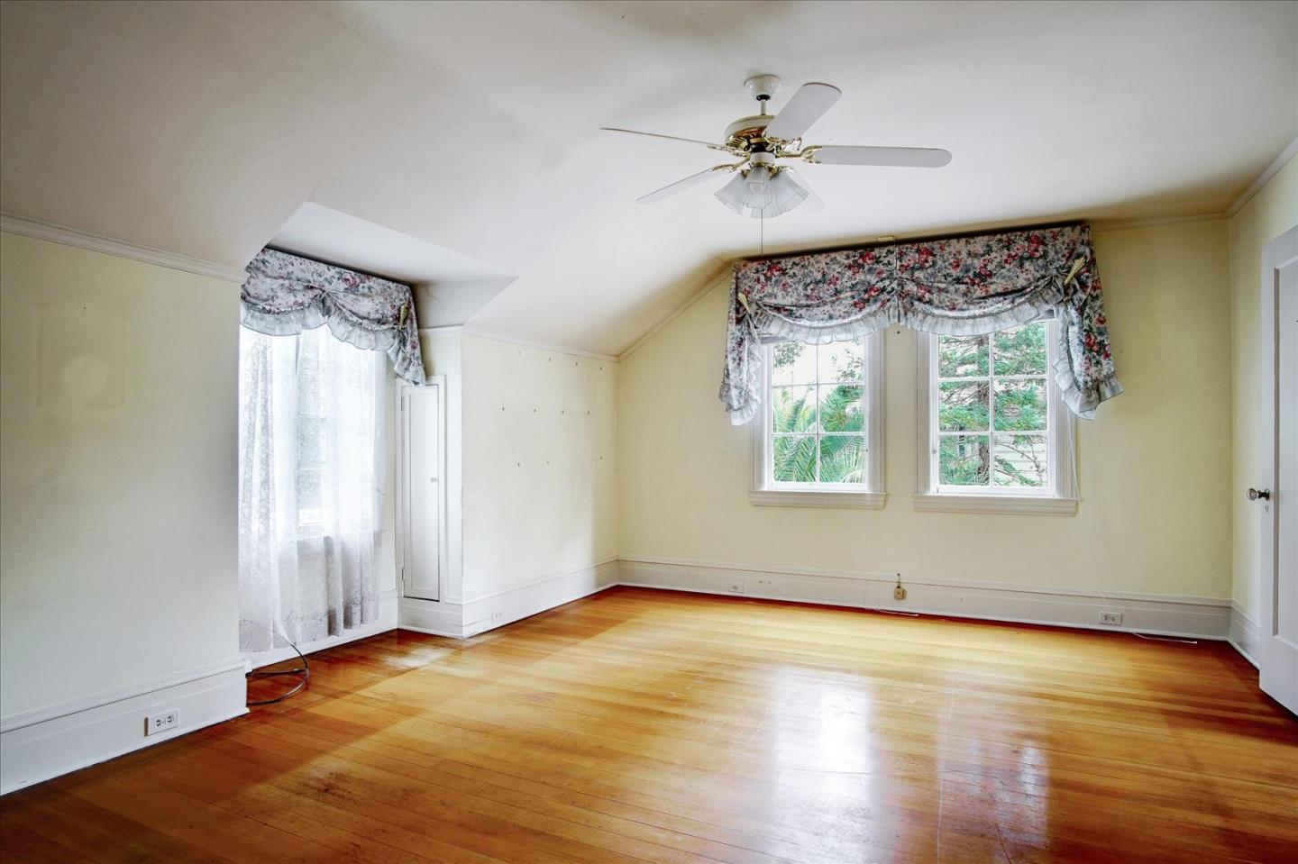 286 5th Street Gilroy, CA 95020 - Photo 27 of 47 a view of an empty room with a window and wooden floor