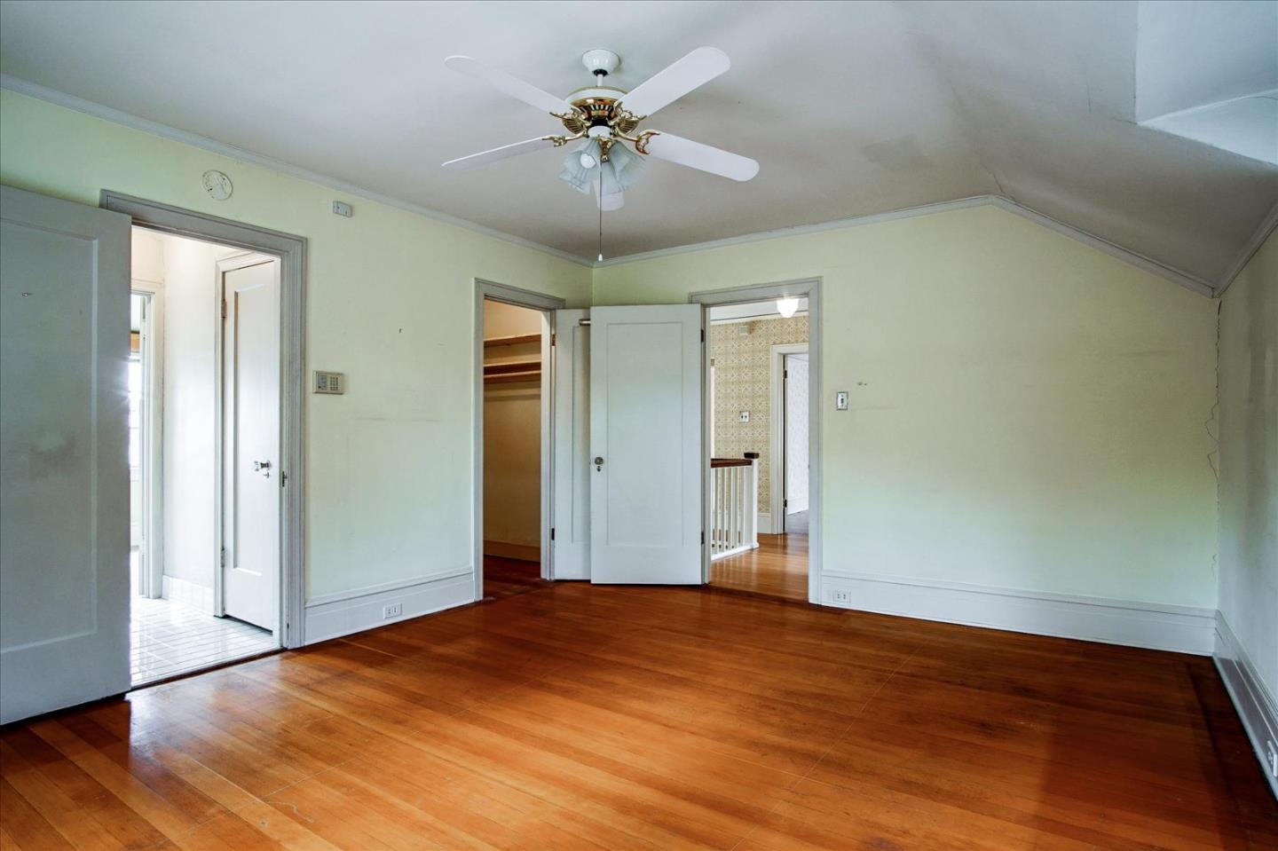 286 5th Street Gilroy, CA 95020 - Photo 29 of 47 an empty room with wooden floor and fan