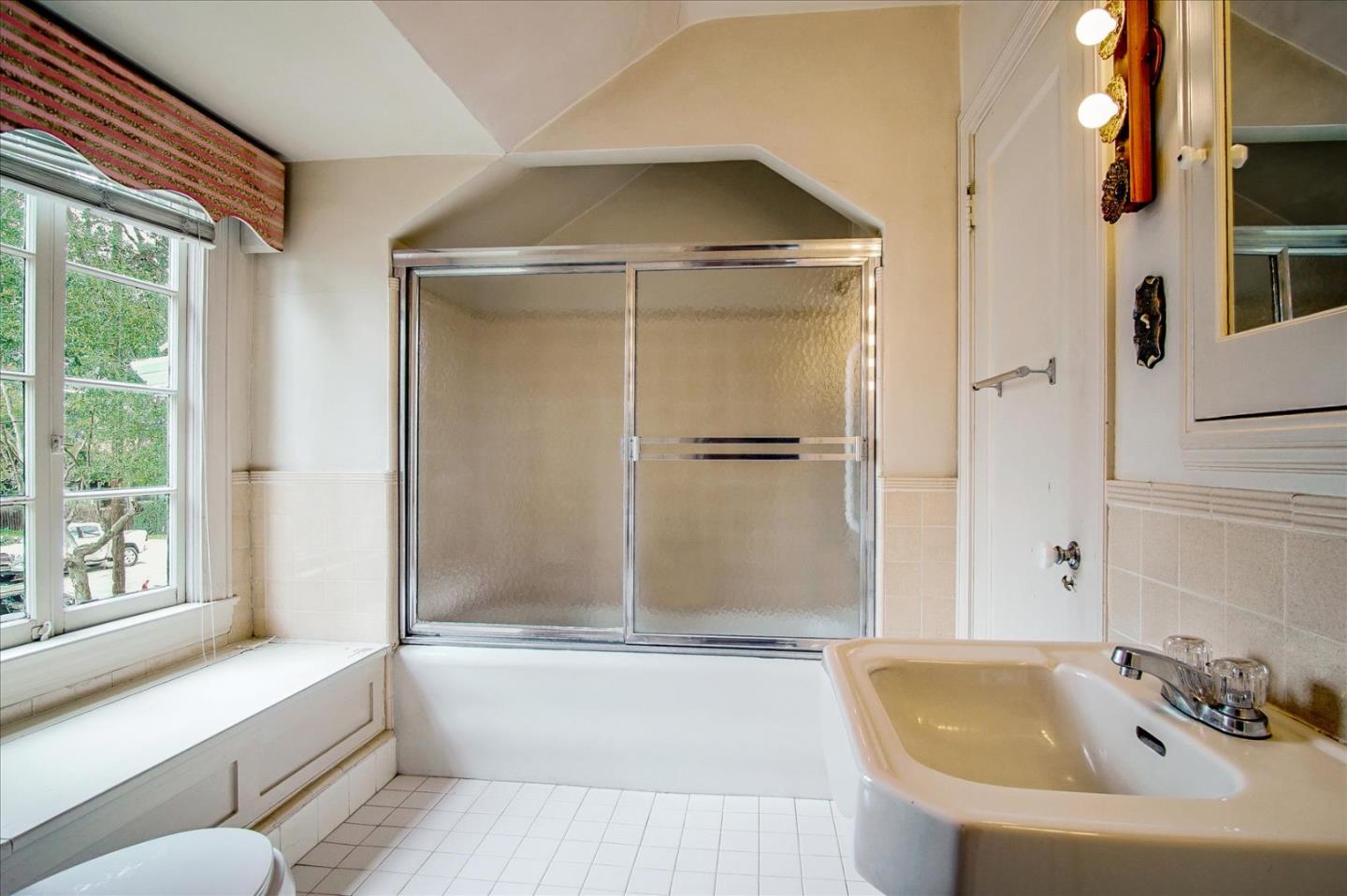 286 5th Street Gilroy, CA 95020 - Photo 35 of 47 a bathroom with a bathtub and a shower