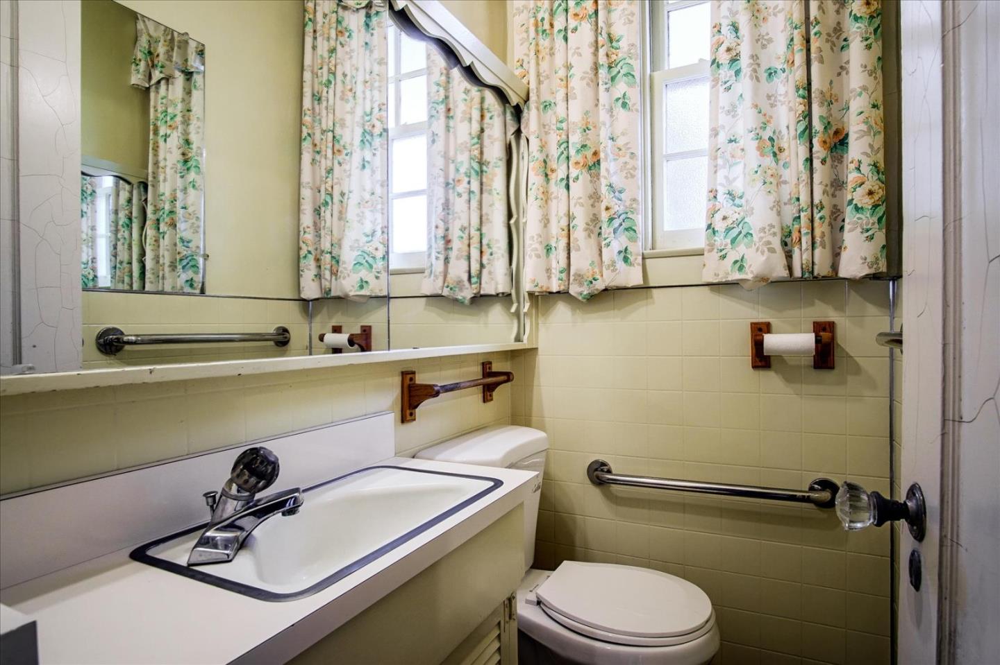 286 5th Street Gilroy, CA 95020 - Photo 36 of 47 a bathroom with a sink a toilet and a window
