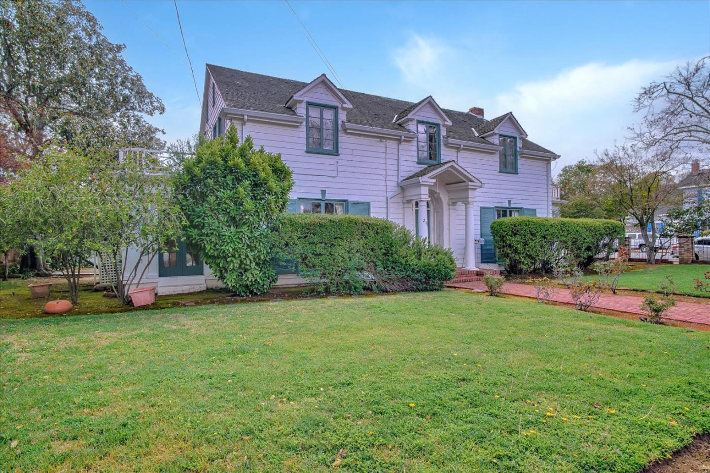 286 5th Street Gilroy, CA 95020 - Photo 5 of 47 a view of a house with a big yard and large trees