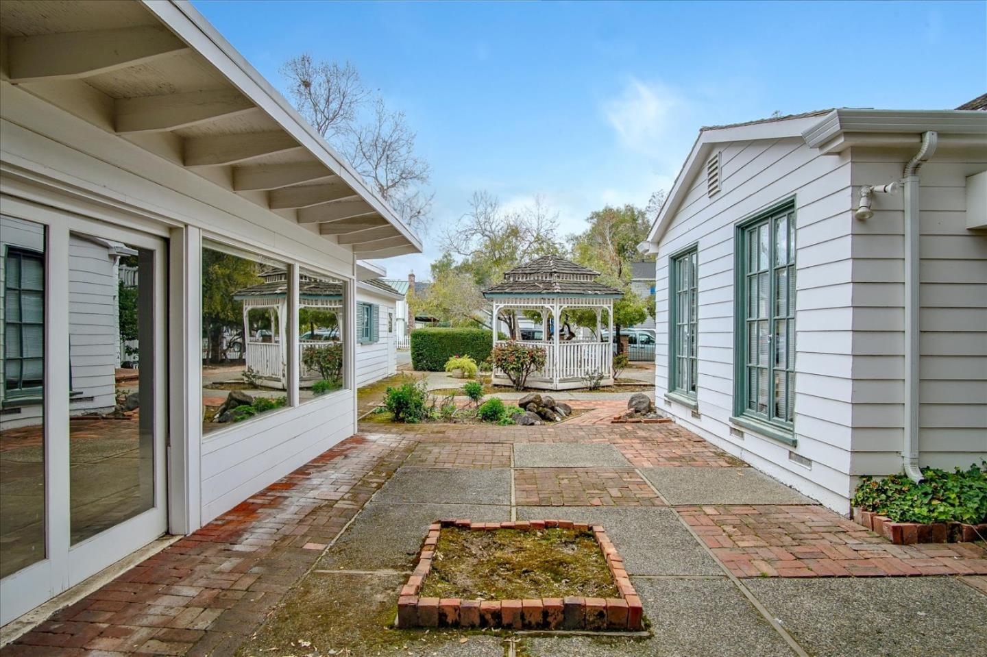 286 5th Street Gilroy, CA 95020 - Photo 47 of 47 a view of a patio with table and chairs and potted plants