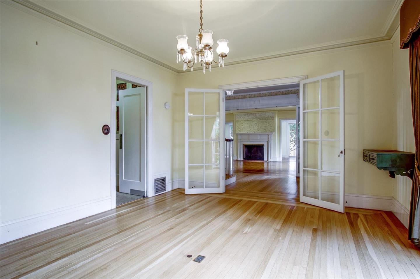286 5th Street Gilroy, CA 95020 - Photo 10 of 47 a view of a room with wooden floor and staircase