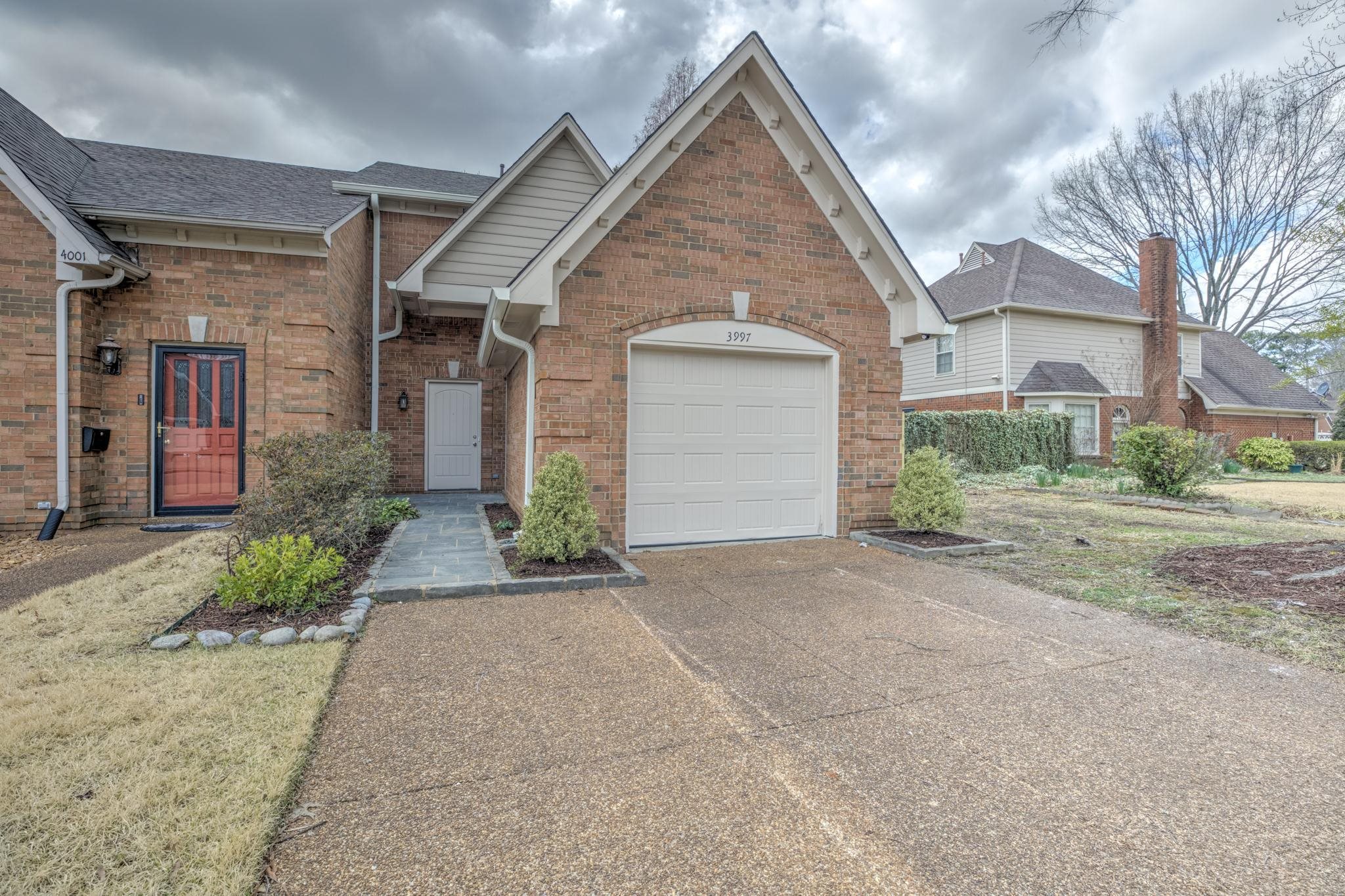 3997 Sawgrass Drive Memphis, TN 38125 - Photo 1 of 24 a view of a house with a yard