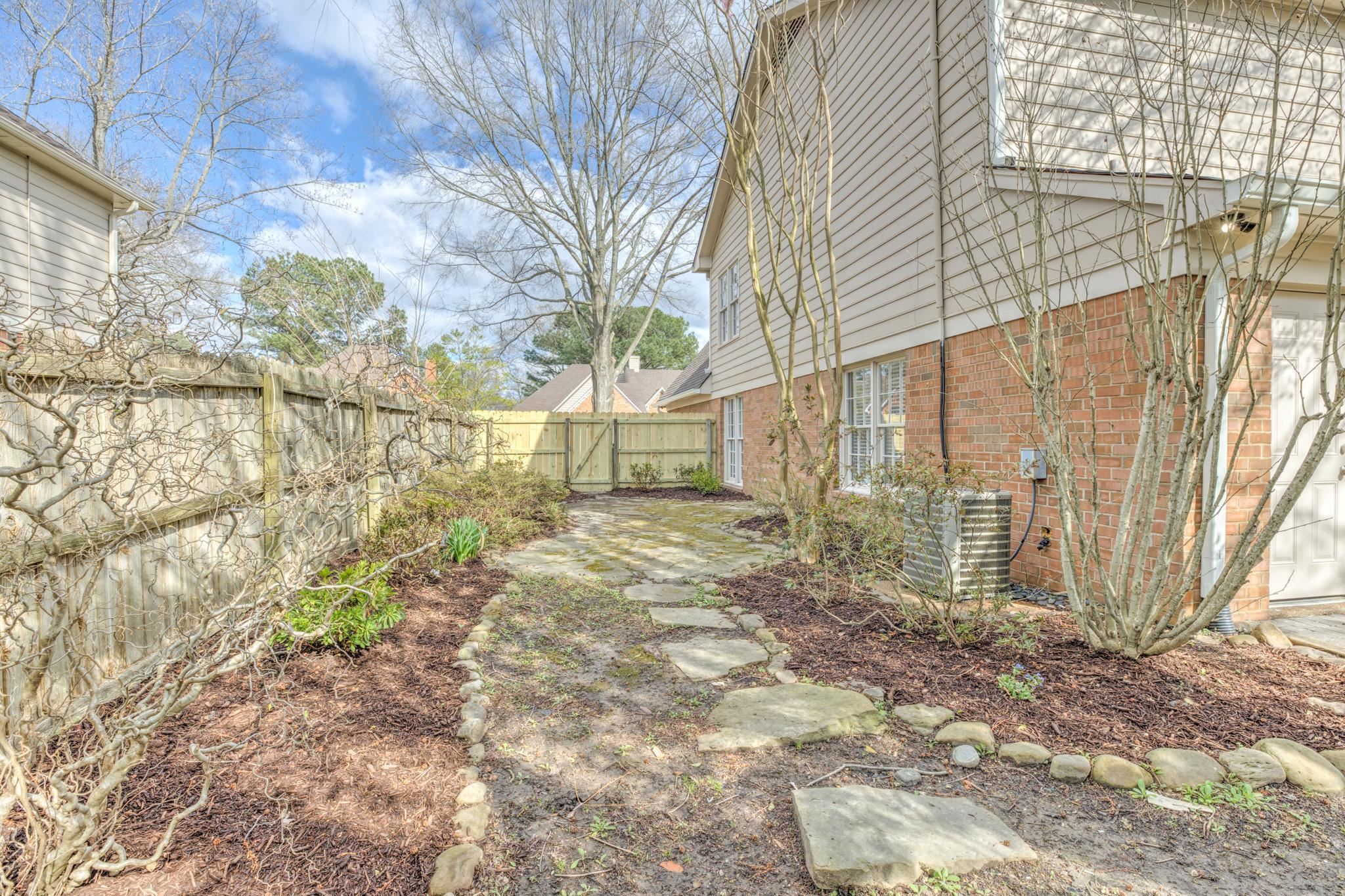 3997 Sawgrass Drive Memphis, TN 38125 - Photo 21 of 24 a view of a back yard of the house
