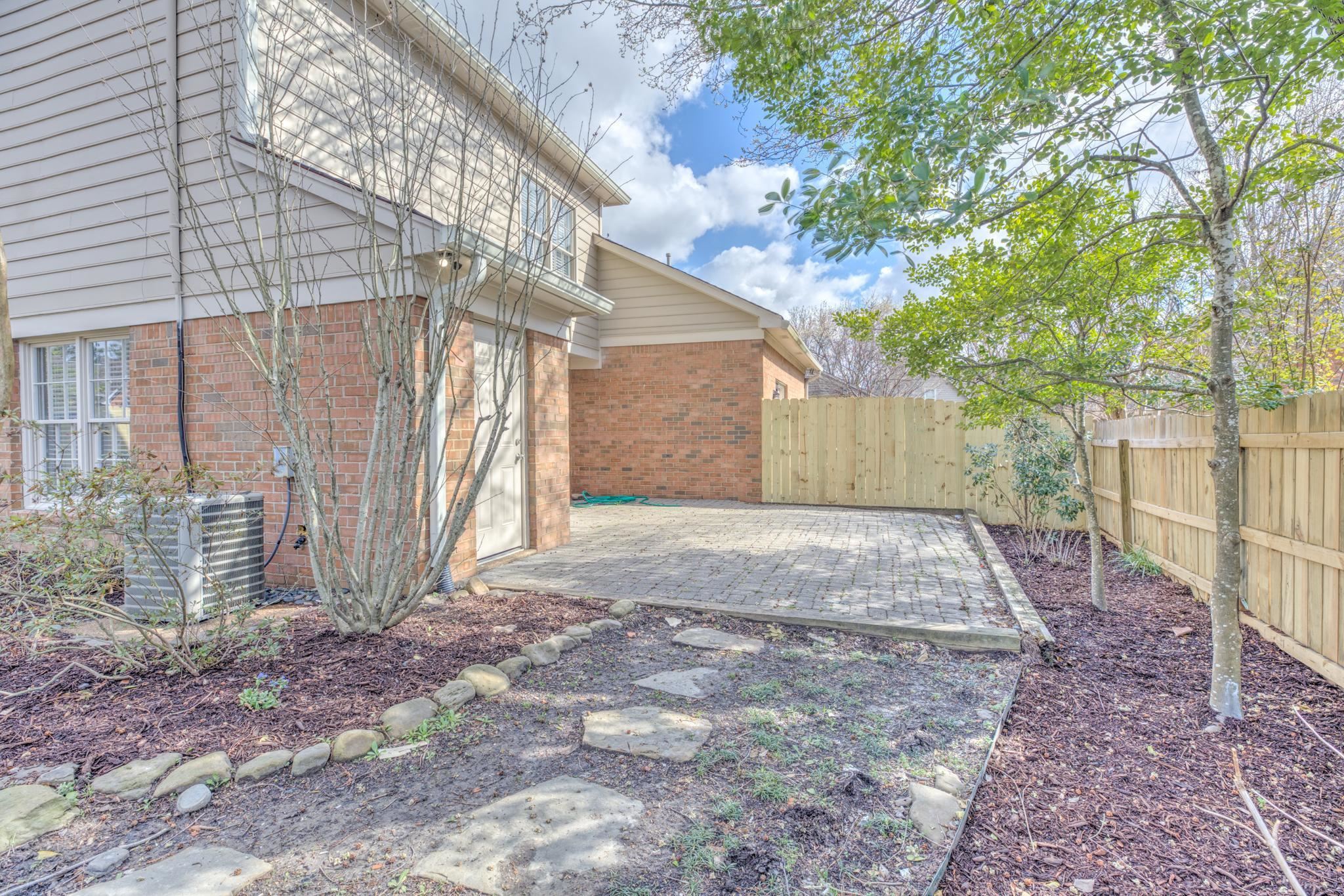 3997 Sawgrass Drive Memphis, TN 38125 - Photo 22 of 24 a view of a backyard with plants and large tree