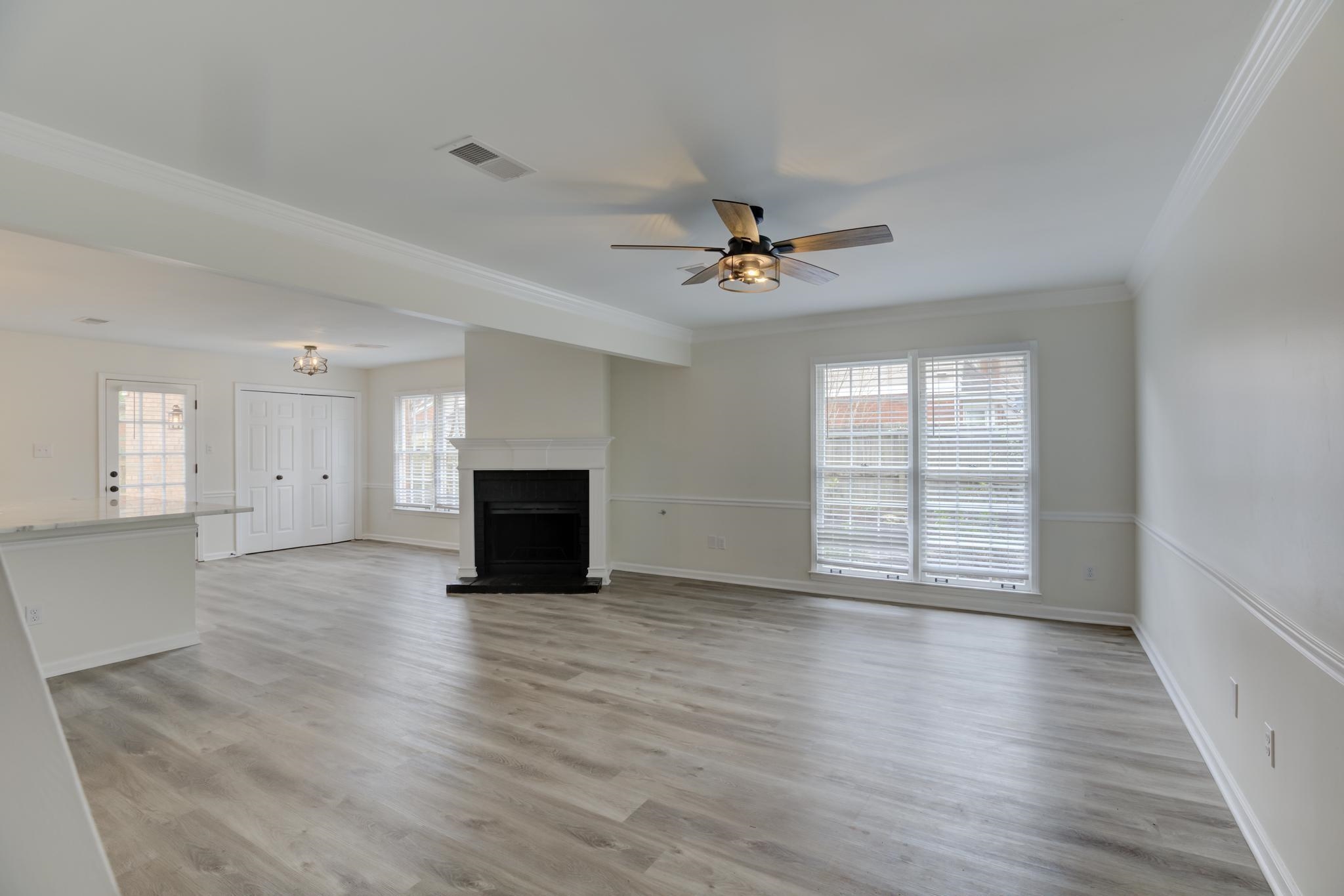 3997 Sawgrass Drive Memphis, TN 38125 - Photo 4 of 24 wooden floor in an empty room with a fireplace