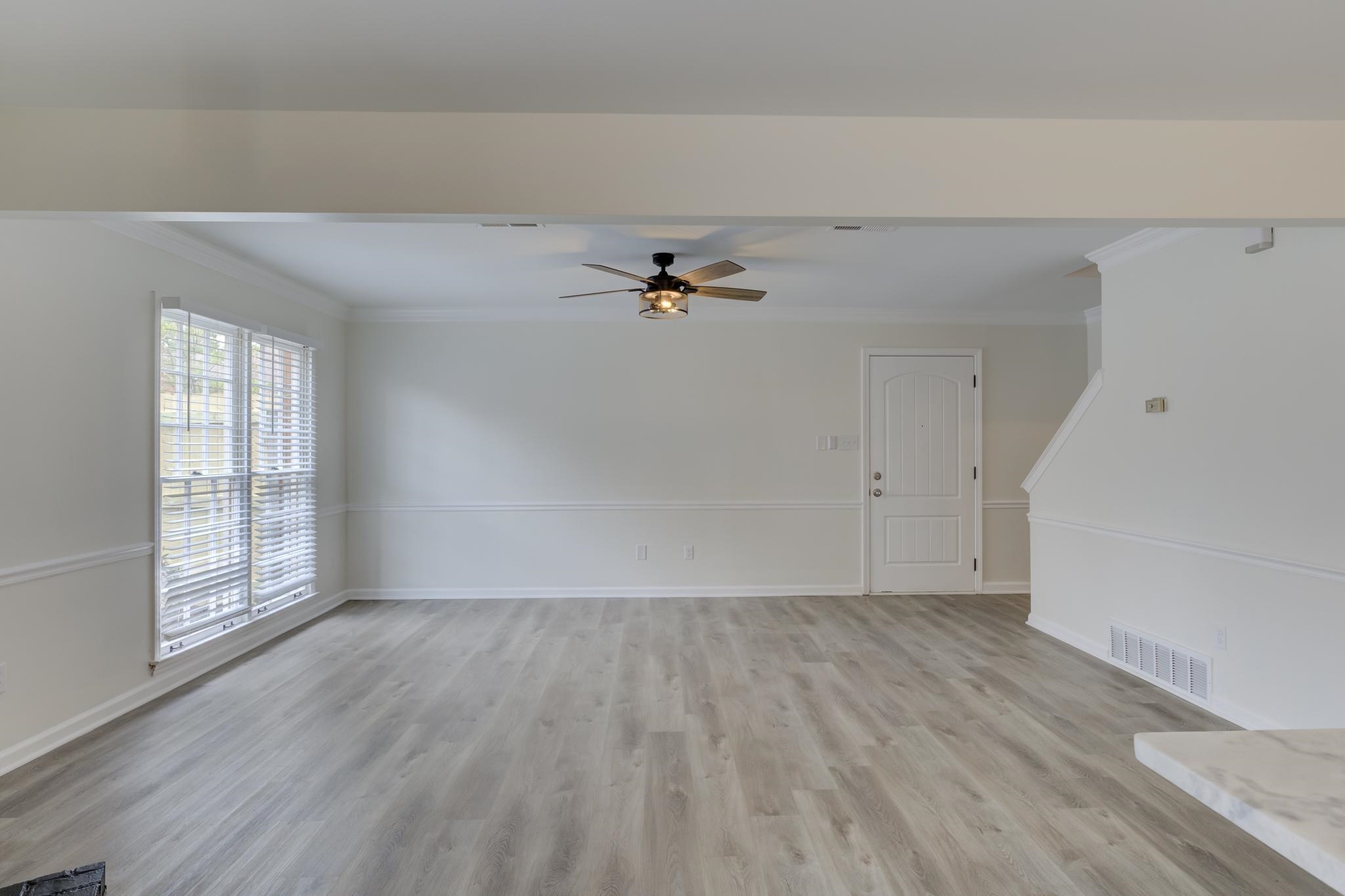 3997 Sawgrass Drive Memphis, TN 38125 - Photo 7 of 24 wooden floor in an empty room with a window