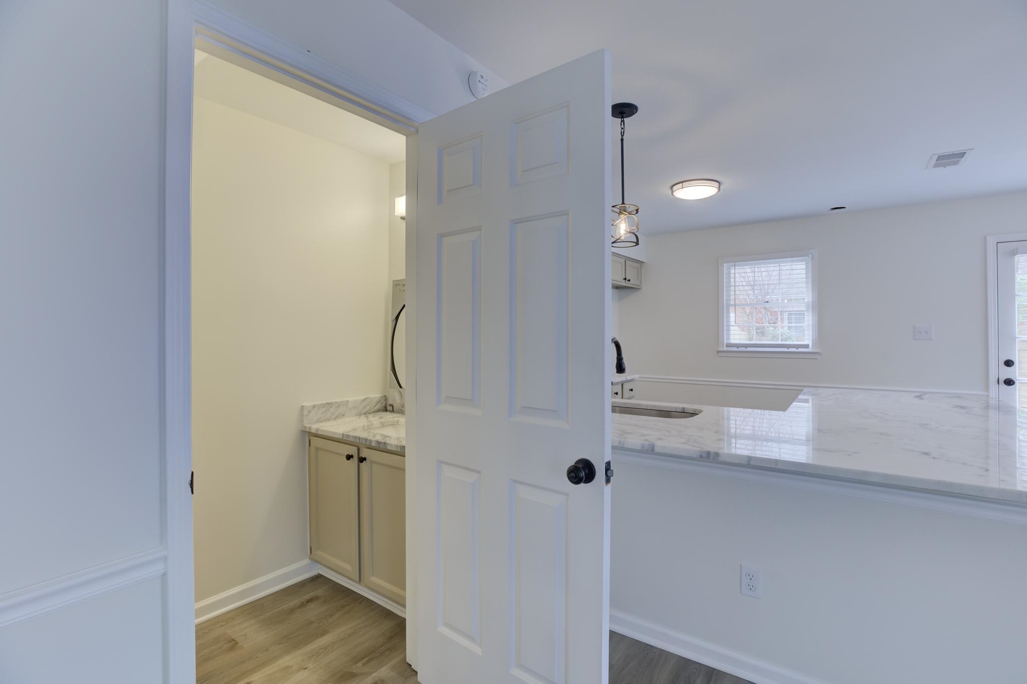 3997 Sawgrass Drive Memphis, TN 38125 - Photo 10 of 24 a bathroom with a granite countertop sink and a mirror