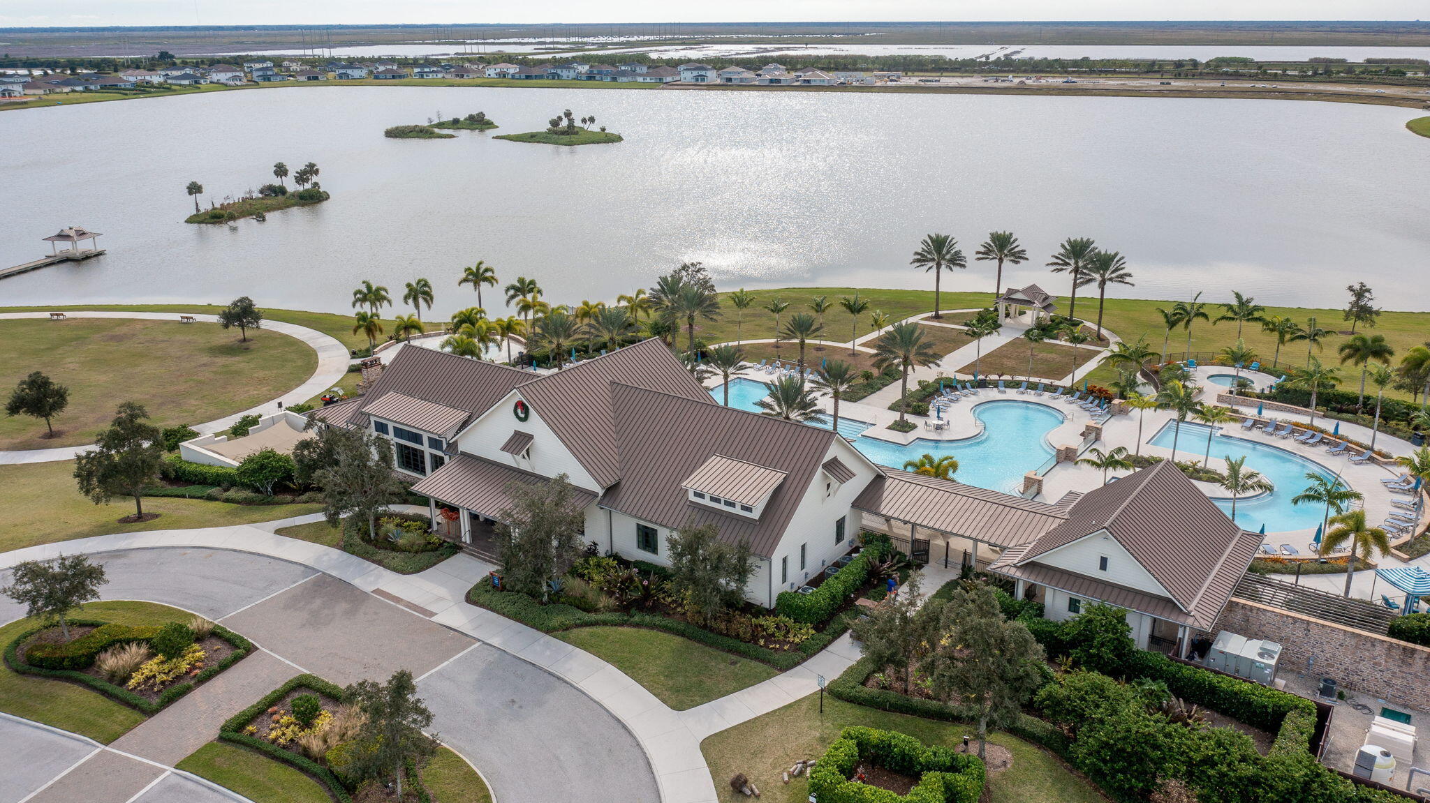 19546 Weathervane Way Loxahatchee, FL 33470 - Photo 54 of 63 an aerial view of a house with a swimming pool and outdoor seating