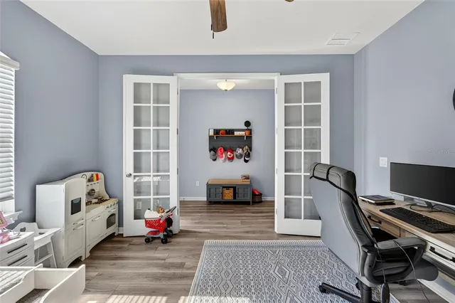 a bedroom with furniture and a window