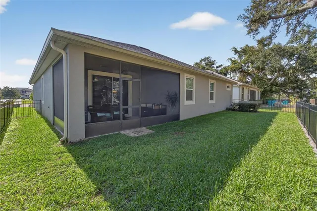 a view of backyard of house and garden