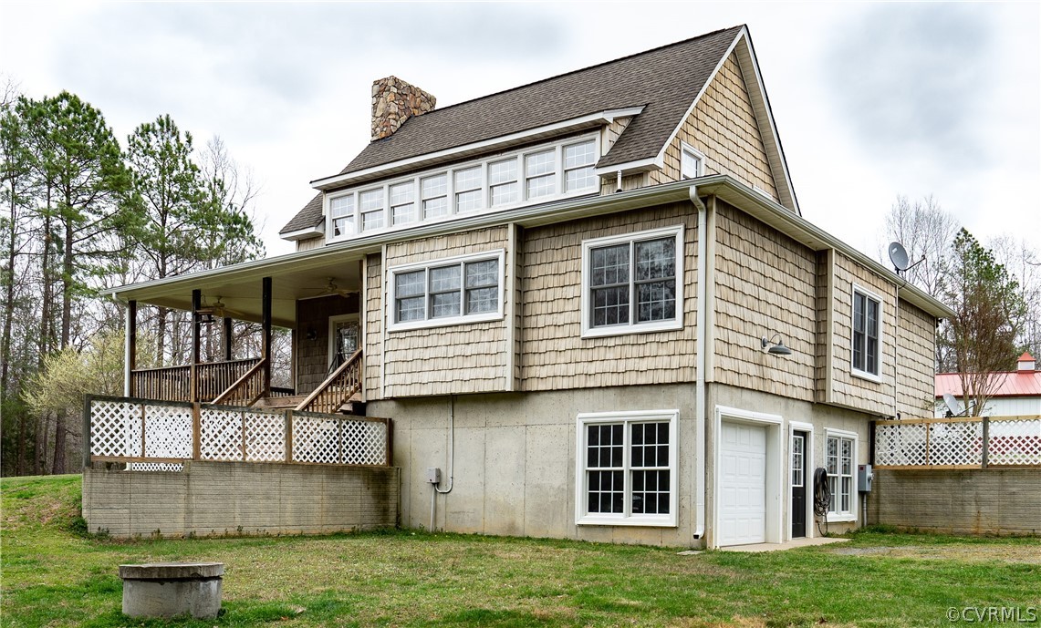 16372 Ancient Acres Road Beaverdam, VA 23015 - Photo 36 of 44 a front view of a house with a garden and plants