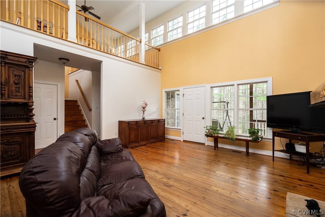 16372 Ancient Acres Road Beaverdam, VA 23015 - Photo 4 of 44 a living room with furniture wooden floor and a flat screen tv