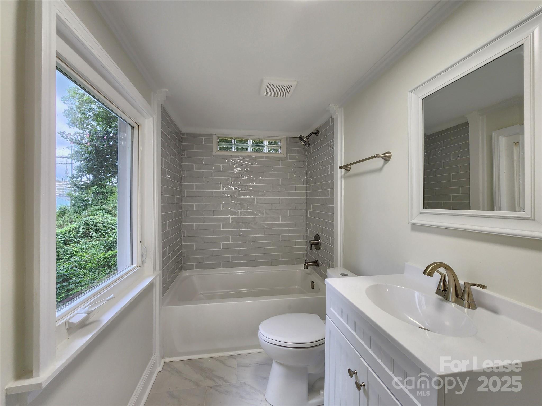 179 Duval Street Northwest Concord, NC 28025 - Photo 11 of 18 a bathroom with a sink a toilet and shower