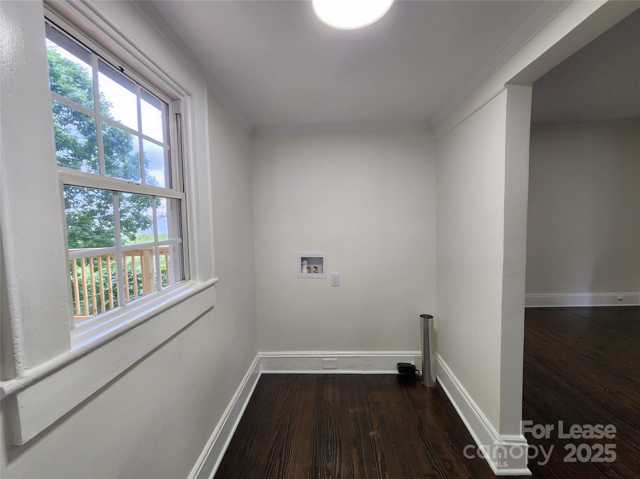 179 Duval Street Northwest Concord, NC 28025 - Photo 9 of 18 a view of a room with wooden floor and a window