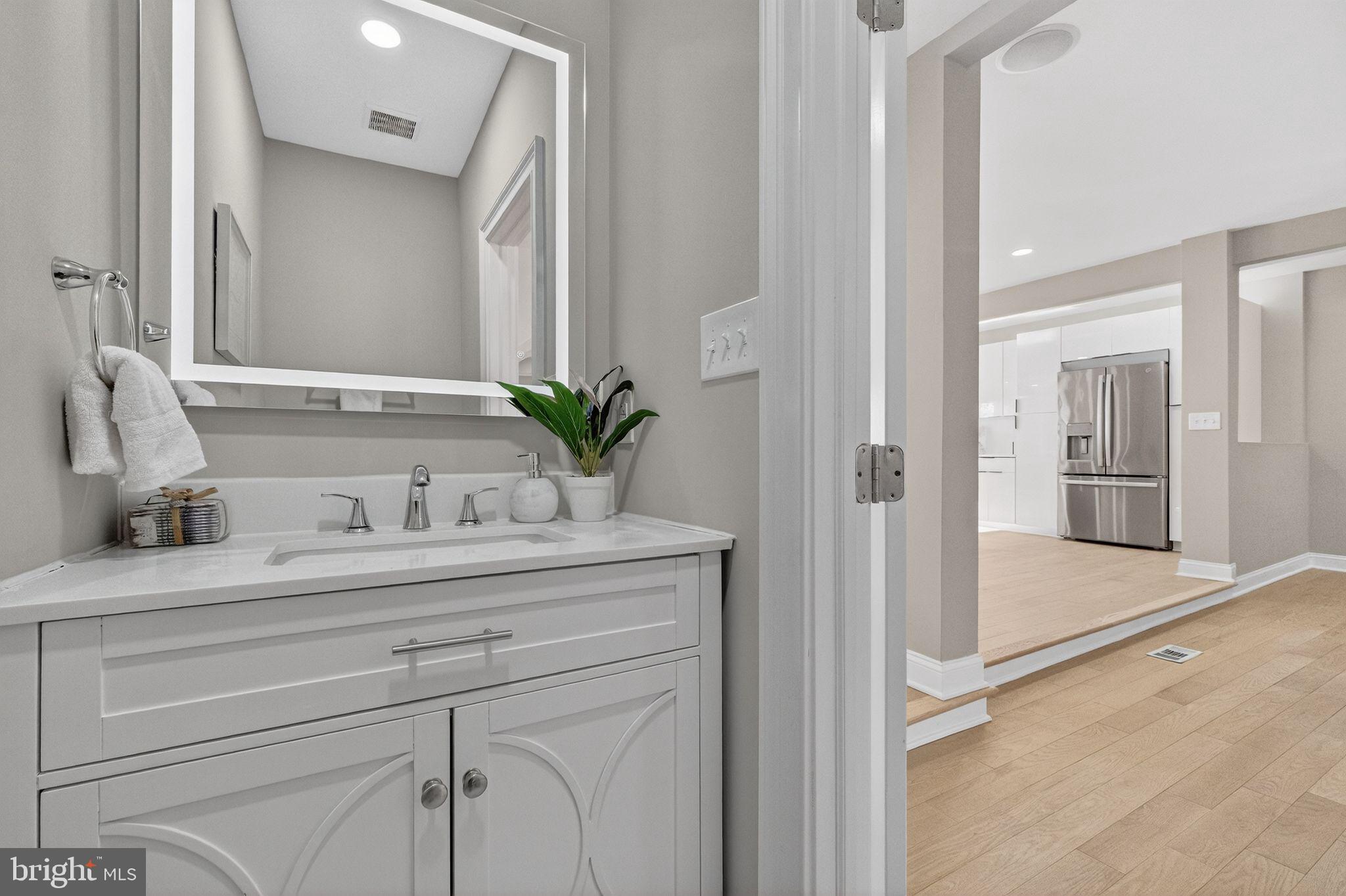 3151 Newton Street Northeast Washington, DC 20018 - Photo 12 of 49 a view of bathroom with a sink and mirror