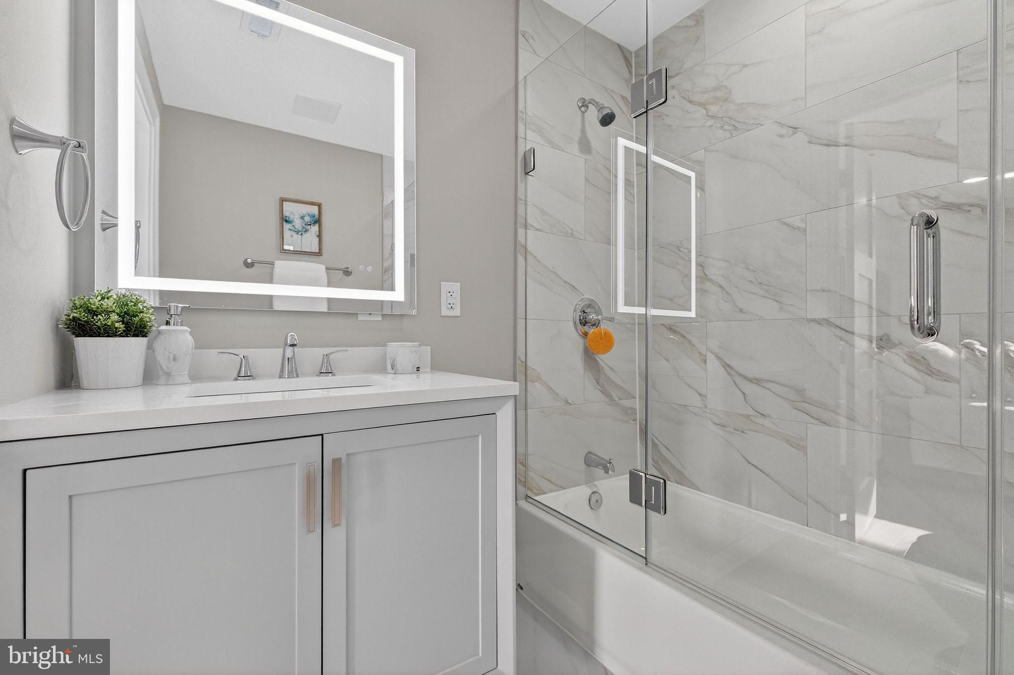 3151 Newton Street Northeast Washington, DC 20018 - Photo 21 of 49 a bathroom with a sink and a tub