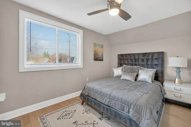 a bedroom with a large bed and a window