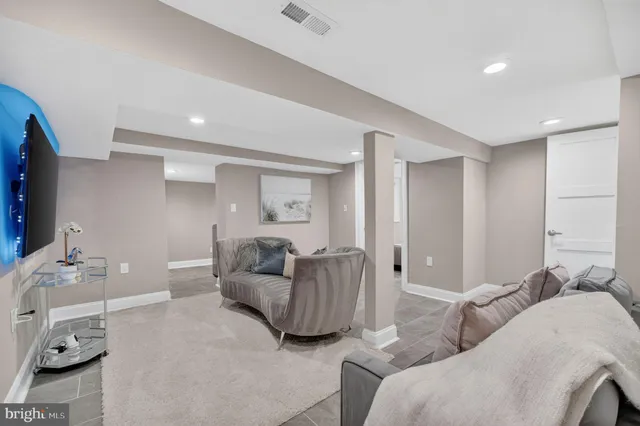 a living room with furniture and a couch