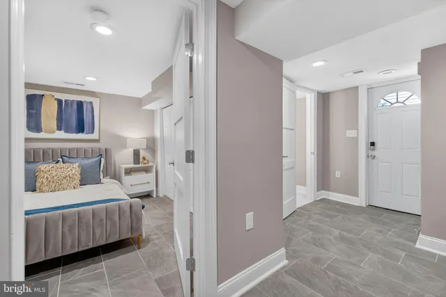 a bedroom with a bed and furniture