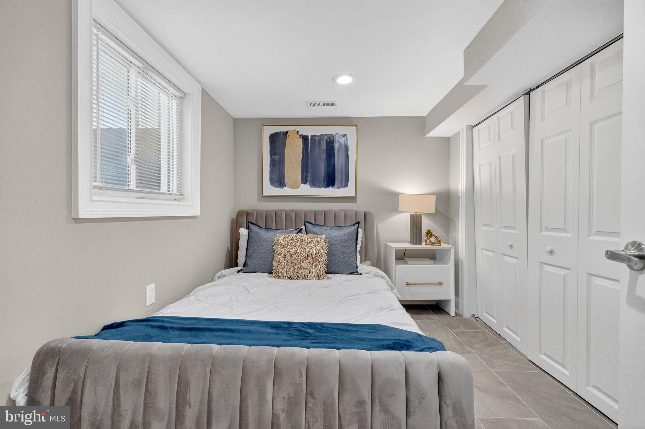 3151 Newton Street Northeast Washington, DC 20018 - Photo 33 of 49 a bedroom with a large bed and a window
