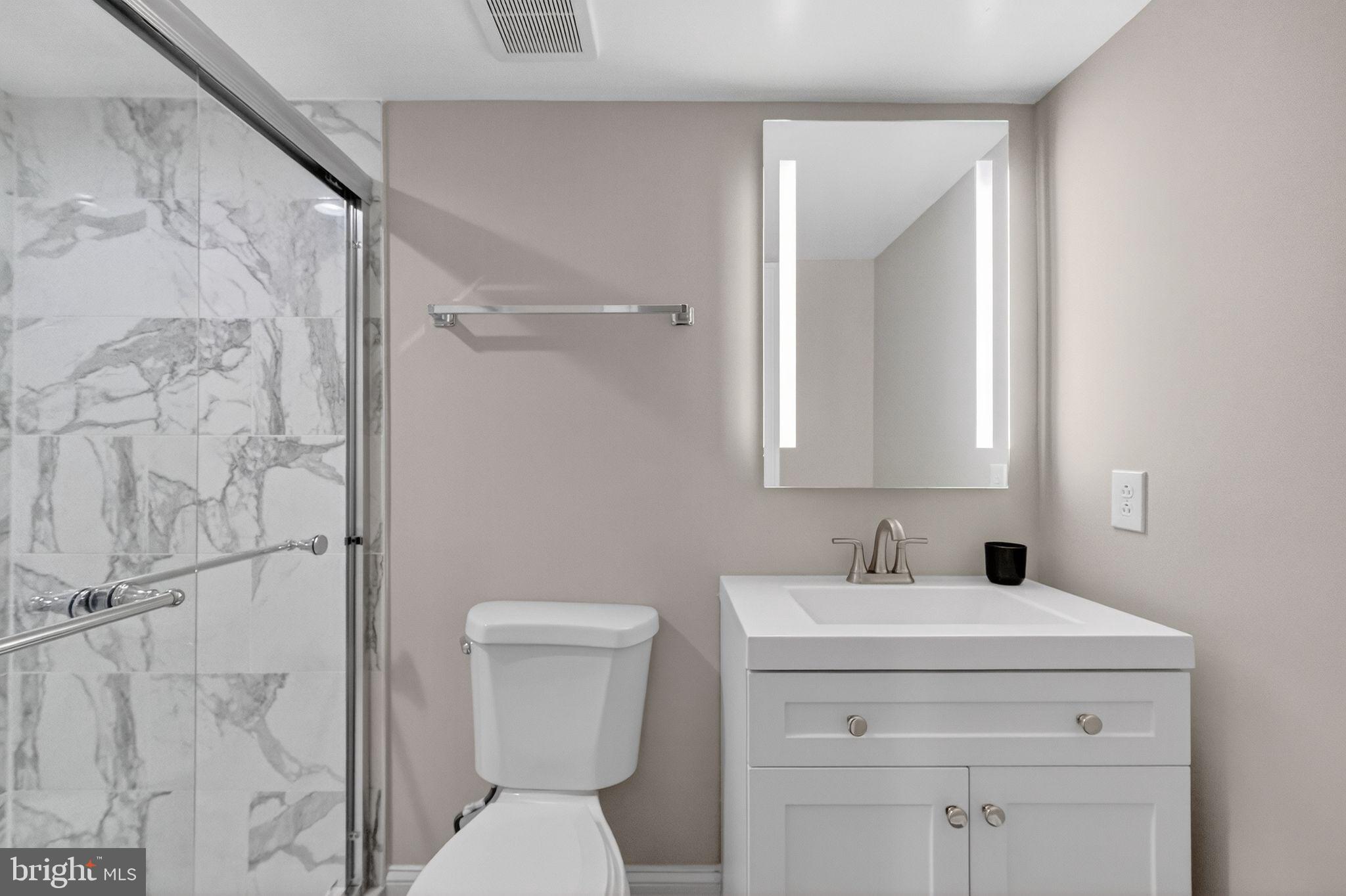 3151 Newton Street Northeast Washington, DC 20018 - Photo 38 of 49 a bathroom with a toilet sink and shower