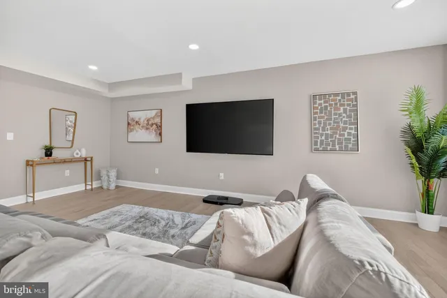 a living room with a couch and a flat screen tv
