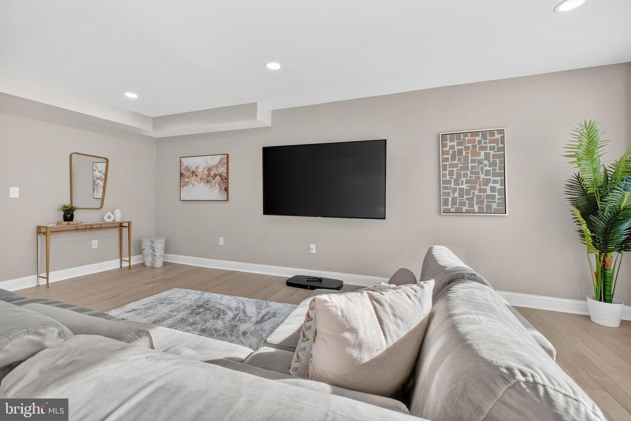 3151 Newton Street Northeast Washington, DC 20018 - Photo 9 of 49 a living room with a couch and a flat screen tv