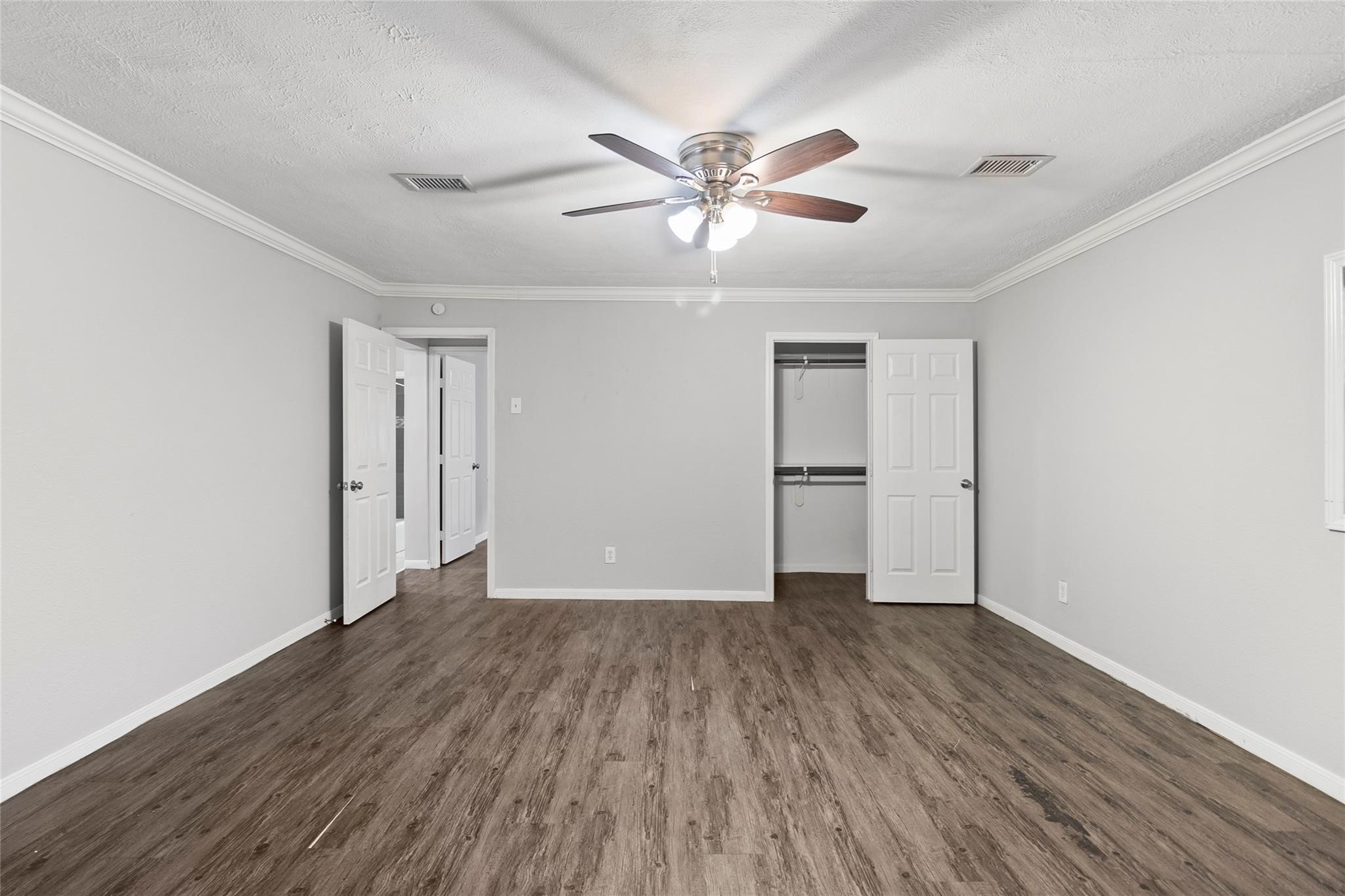 12109 22nd Street Santa Fe, TX 77510 - Photo 6 of 14 a view of an empty room with wooden floor
