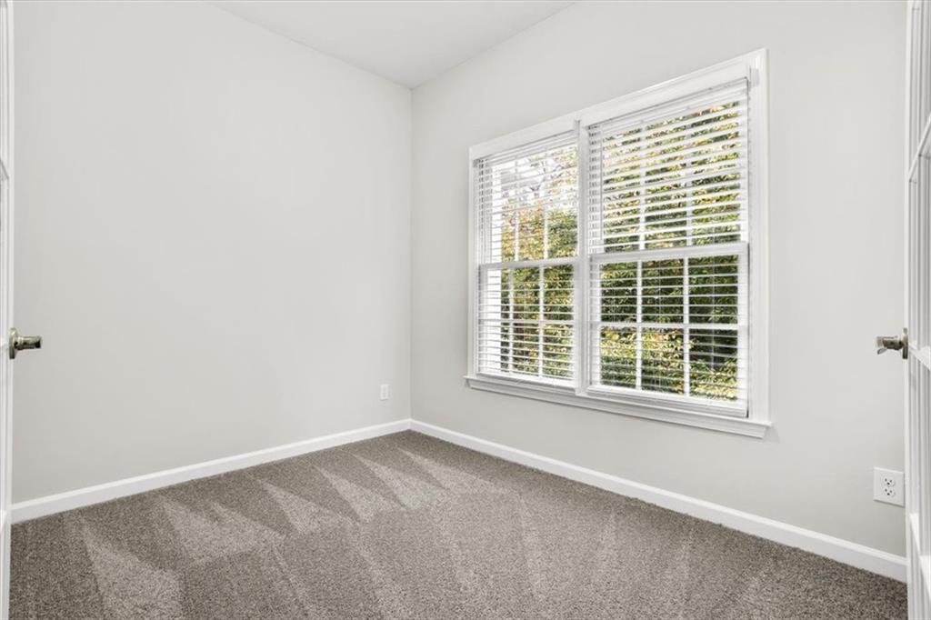 3425 Kingsland Circle Berkeley Lake, GA 30096 - Photo 21 of 45 a view of an empty room with a window