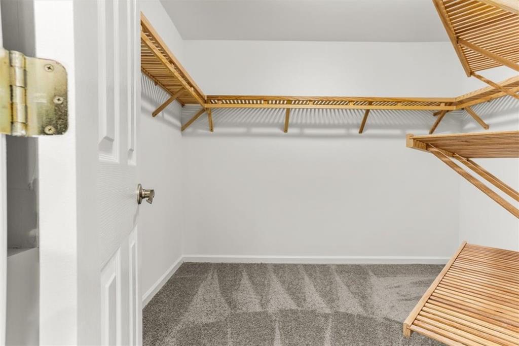 3425 Kingsland Circle Berkeley Lake, GA 30096 - Photo 23 of 45 a view of walk in closet