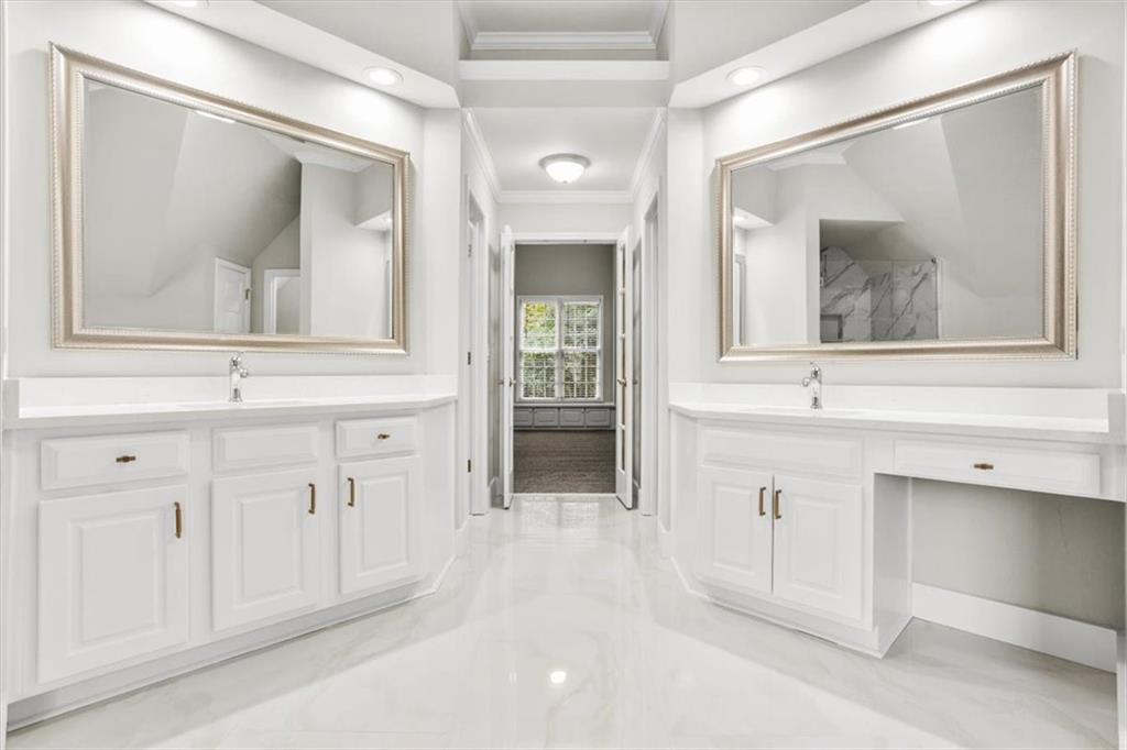 3425 Kingsland Circle Berkeley Lake, GA 30096 - Photo 24 of 45 a view of a bathroom with mirror and vanity