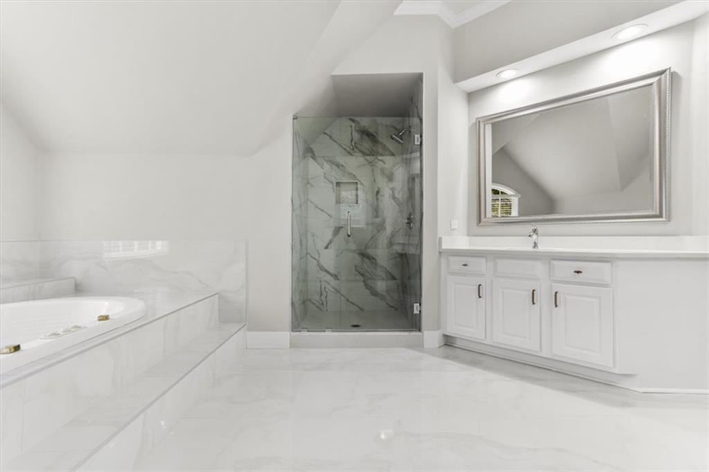 3425 Kingsland Circle Berkeley Lake, GA 30096 - Photo 25 of 45 a bathroom with a bathtub and a shower