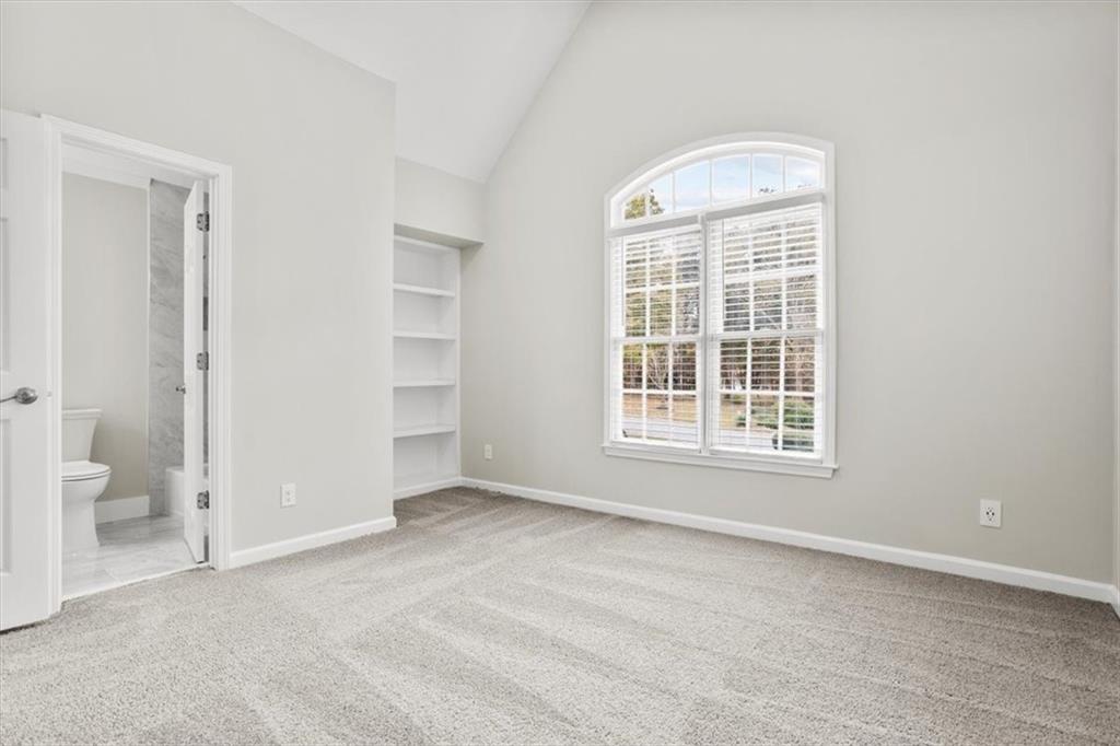 3425 Kingsland Circle Berkeley Lake, GA 30096 - Photo 28 of 45 an empty room with a window and a bathroom