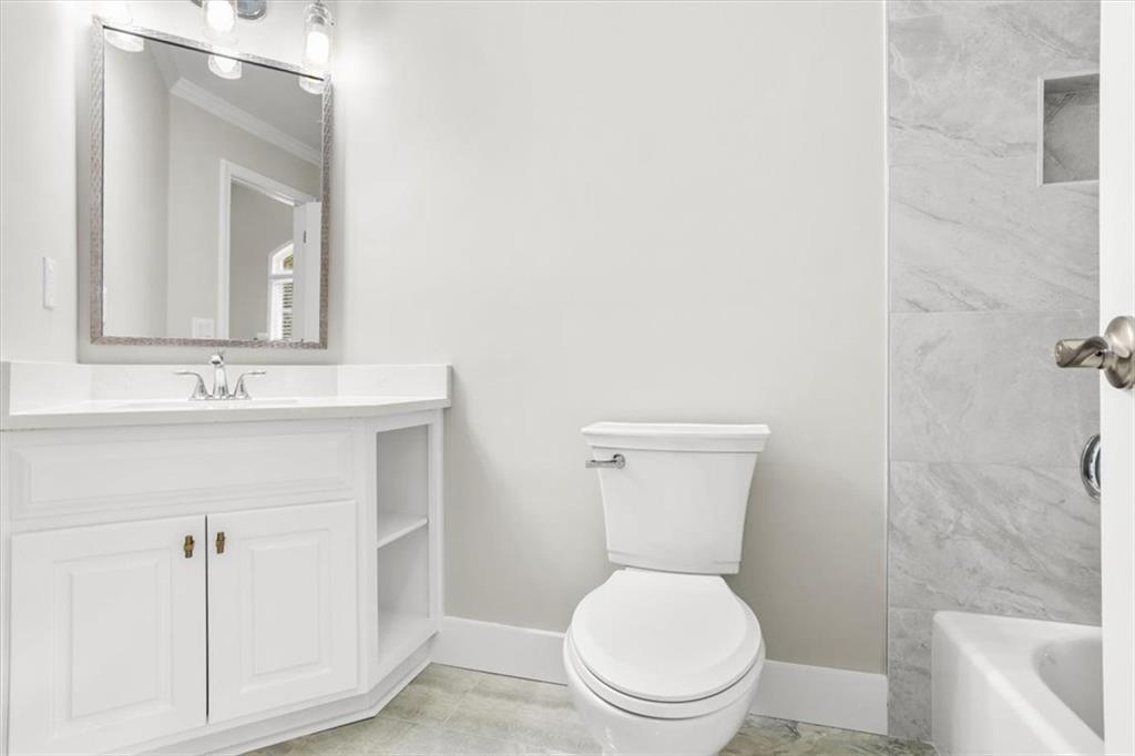 3425 Kingsland Circle Berkeley Lake, GA 30096 - Photo 30 of 45 a white toilet sitting next to a bathroom sink